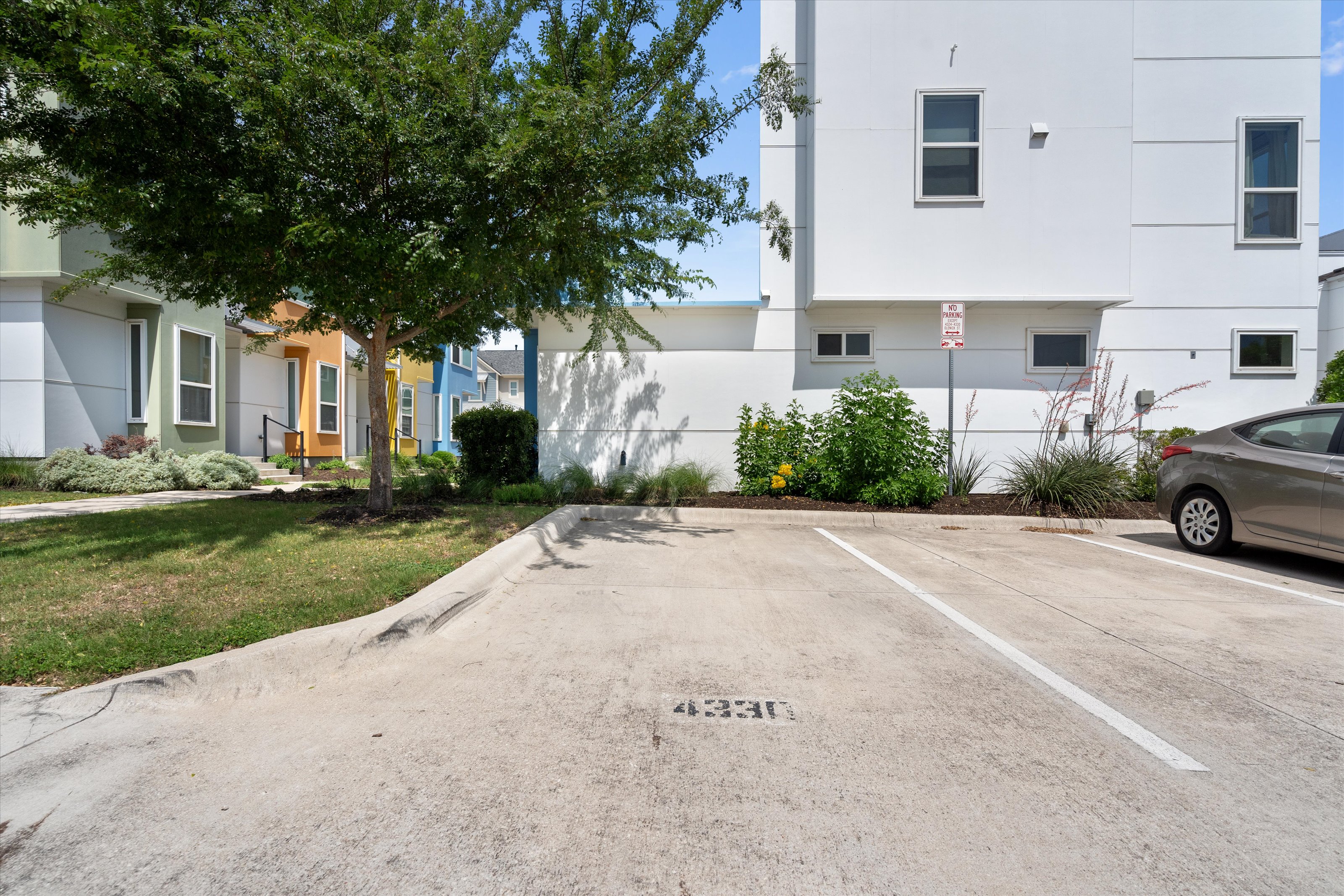 4330 Olenick Street Austin, TX 78723 - Photo 24 of 29 a front view of a house with a yard and garage
