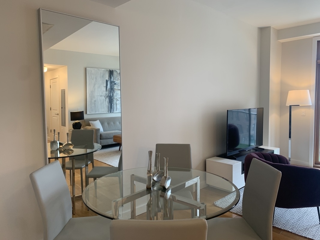 548 4th Avenue, Unit 4B Brooklyn, NY 11215 - Photo 9 of 22 a work room with furniture and wooden floor