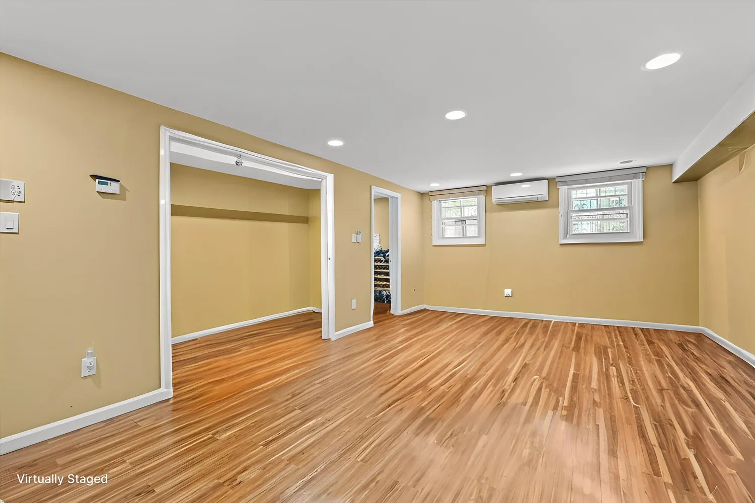wooden floor in an empty room with a window