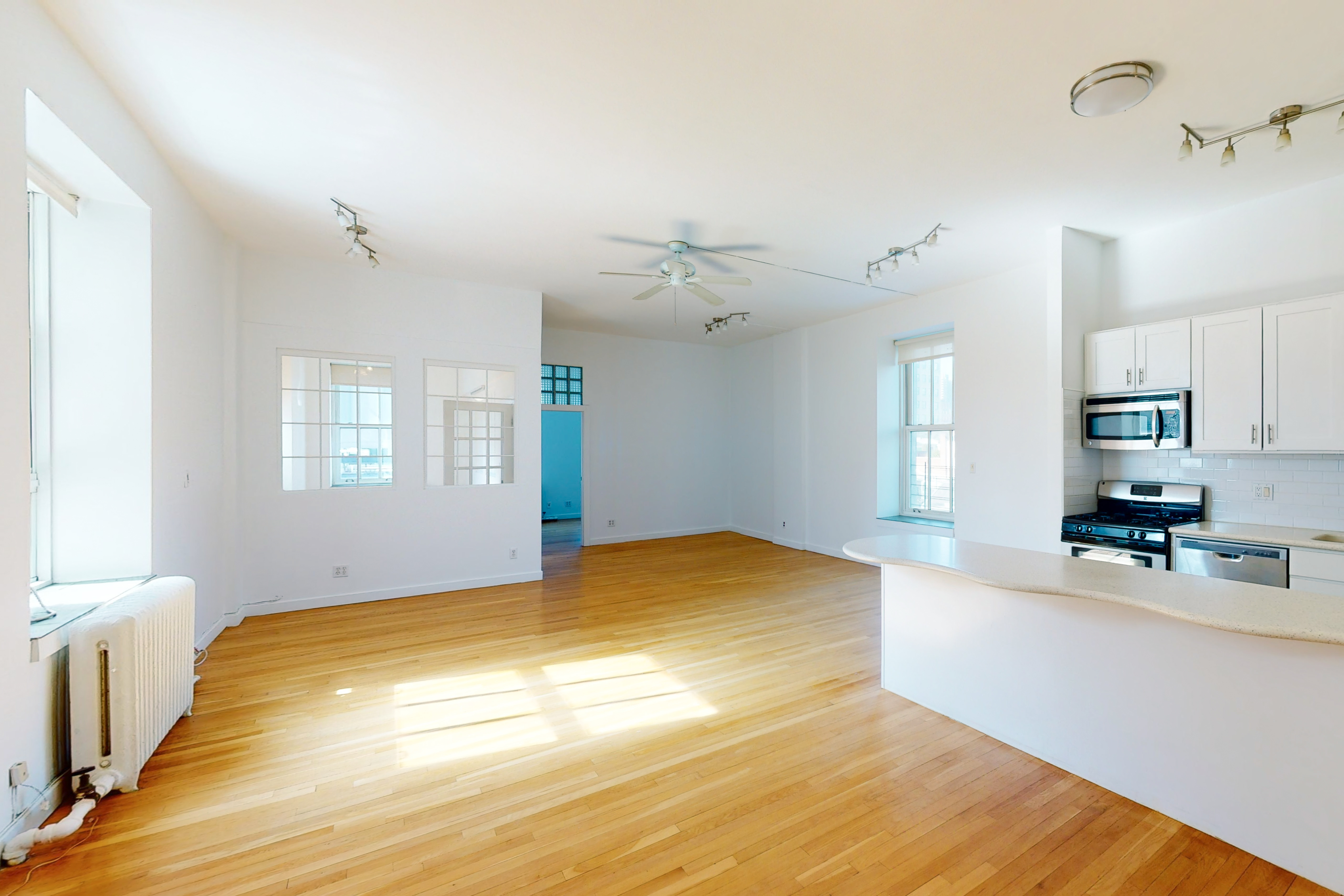 395 Broadway, Unit 7E Manhattan, NY 10013 - Photo 2 of 7 a bedroom with a bed and a window