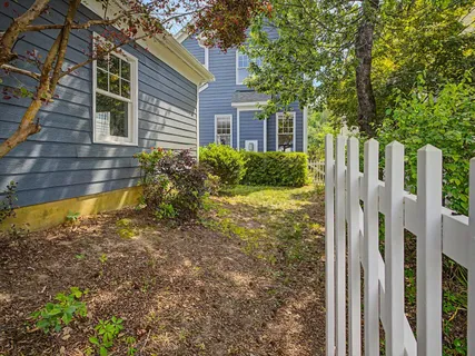 a view of a wooden deck next to a yard