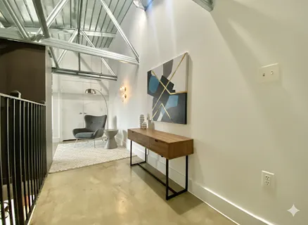 a view of a room with lots of stuff and hardwood