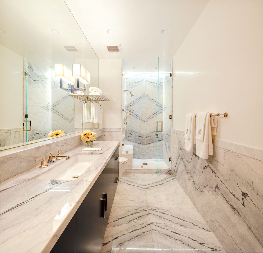 a bathroom with a double vanity sink mirror and