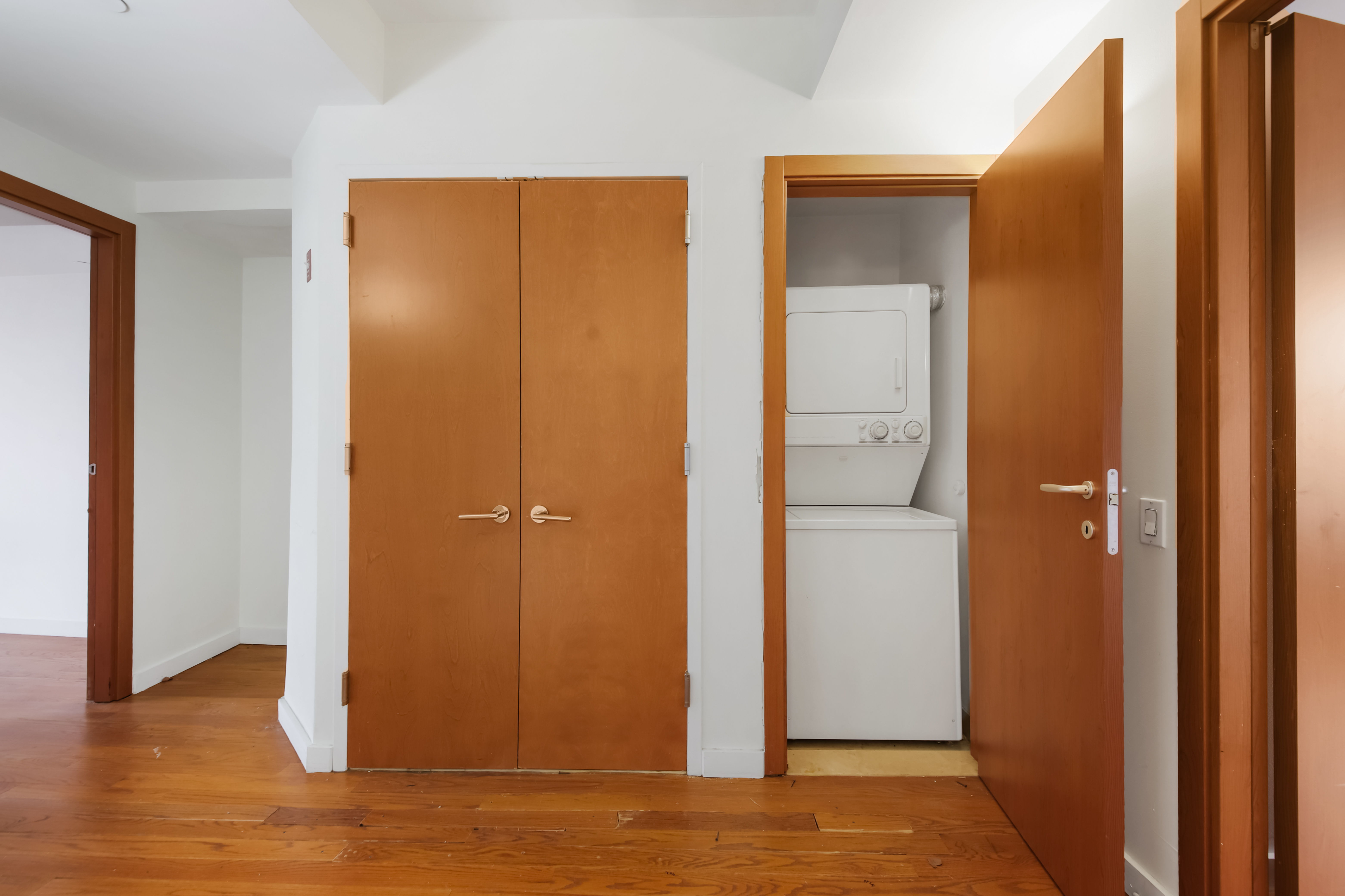3112 Emmons Avenue, Unit 206 Brooklyn, NY 11235 - Photo 6 of 10 a view of a livingroom with wooden floor and closet