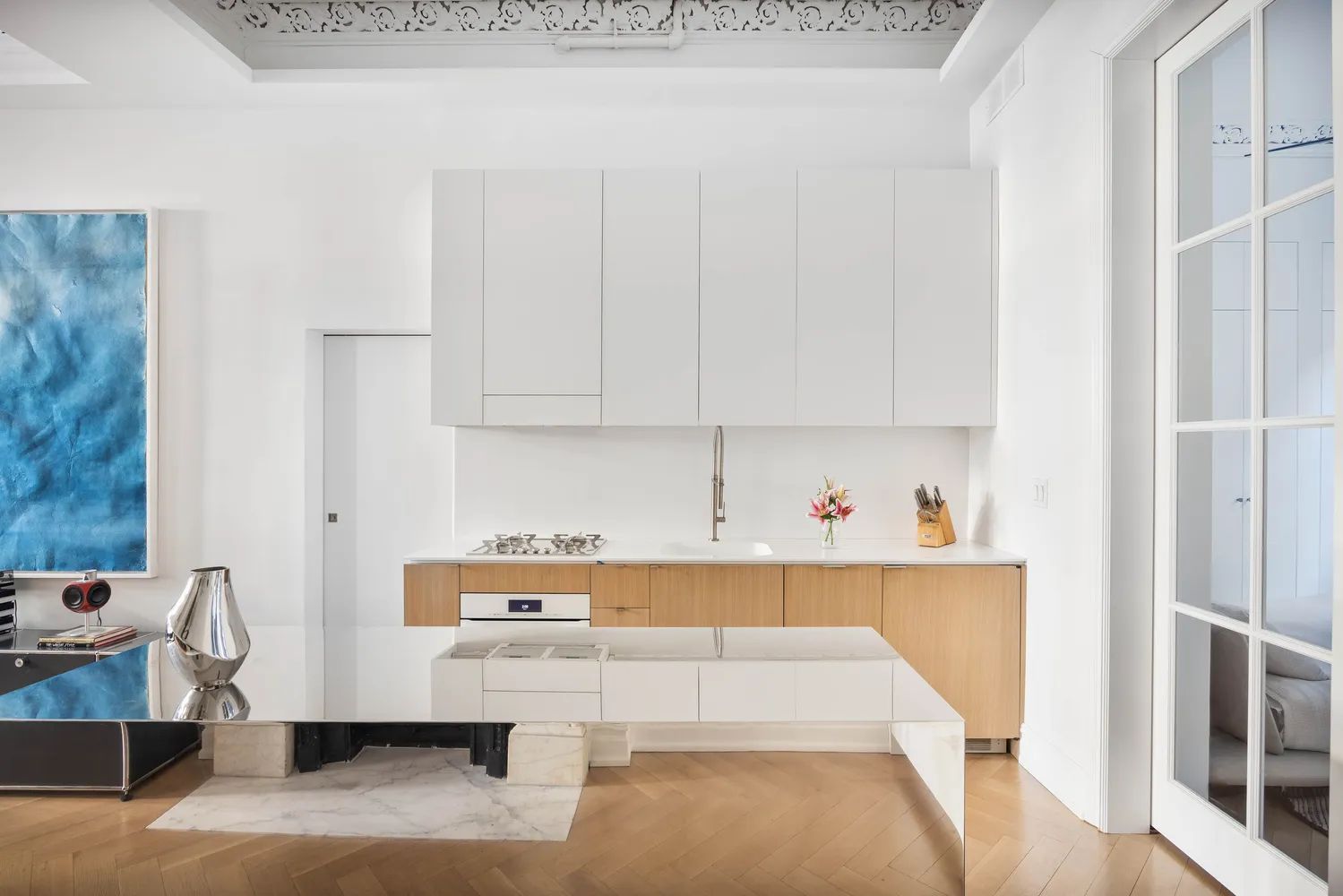 a room with a couch and cabinets