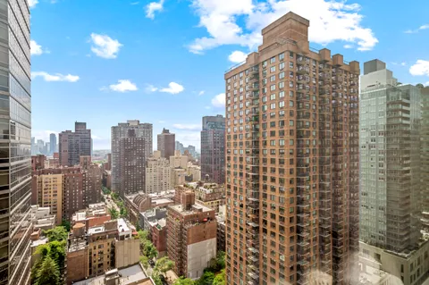 a view of a city with tall buildings