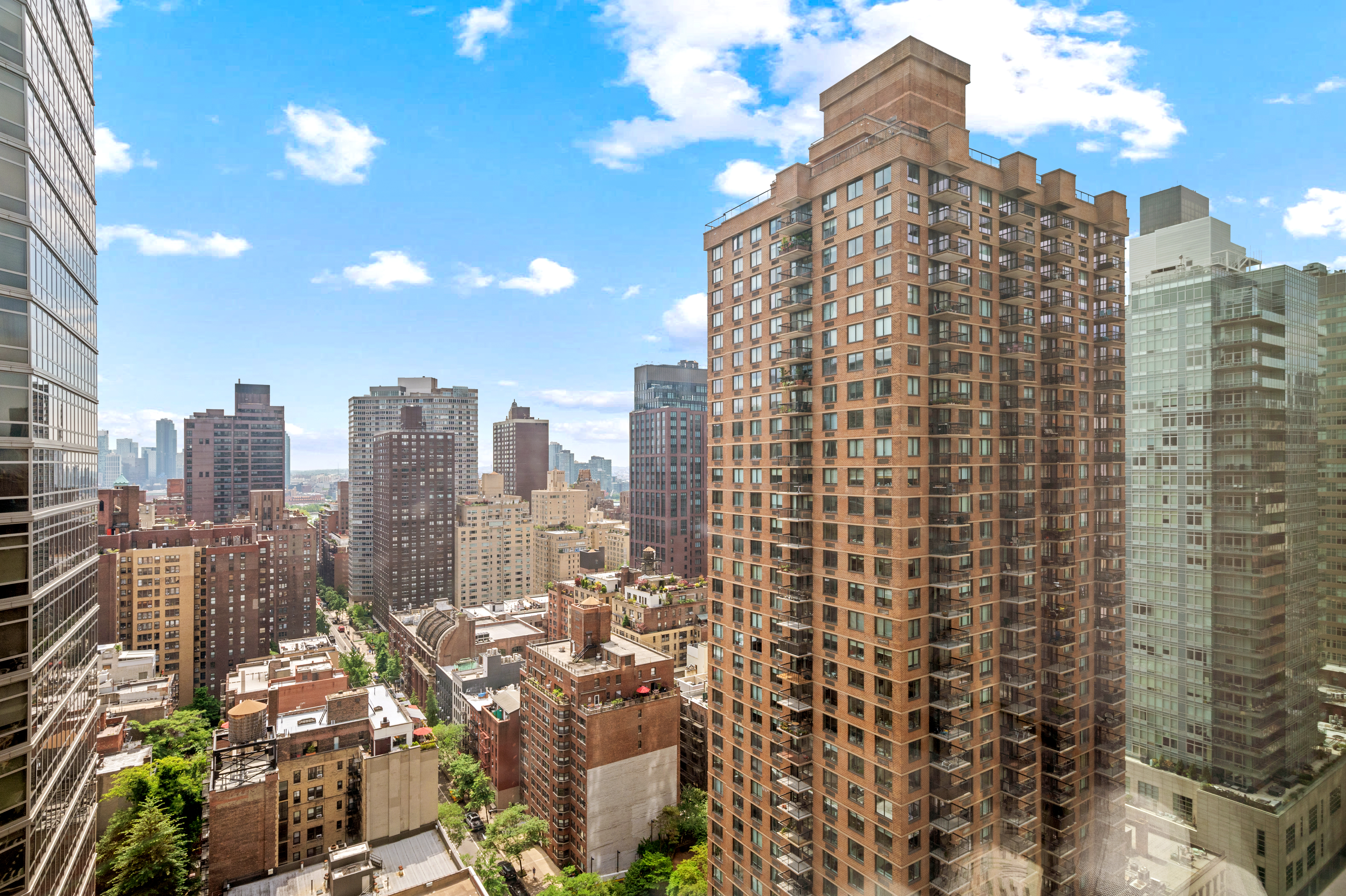 245 East 54th Street, Unit 26JK Manhattan, NY 10022 - Photo 2 of 12 a view of a city with tall buildings