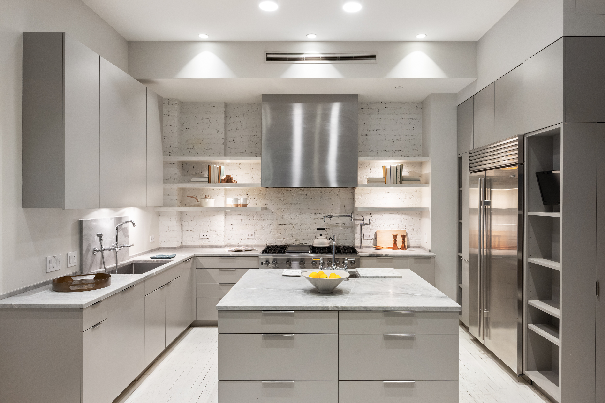 32 West 20th Street, Unit 5 Manhattan, NY 10011 - Photo 8 of 18 a kitchen with a sink a stove and refrigerator