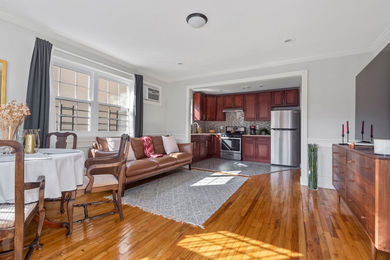 756 Barbey Street, Unit 1A Brooklyn, NY 11207 - Photo 2 of 9 a living room with furniture and a wooden floor