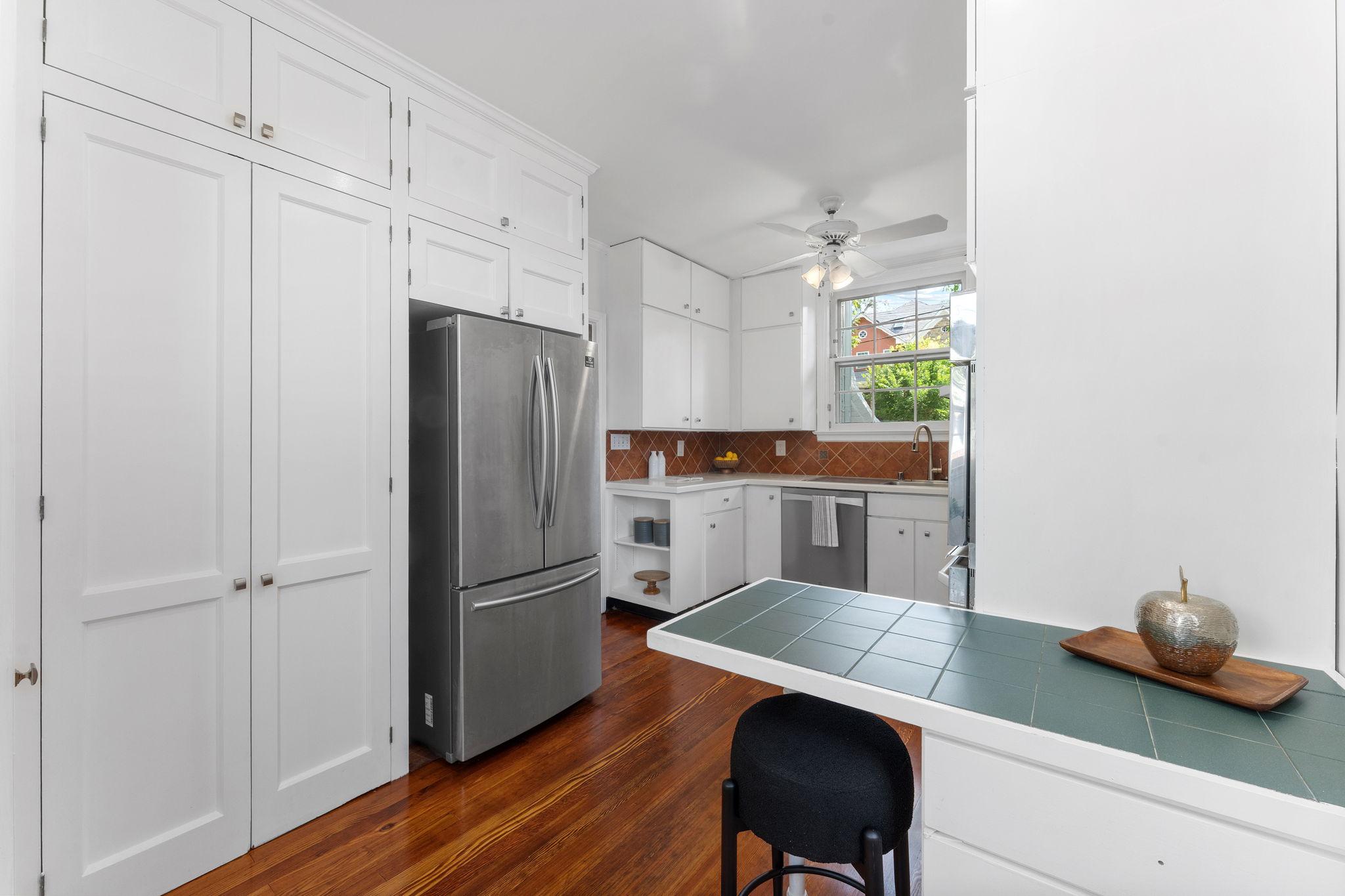1325 Locust Road Northwest Washington, DC 20012 - Photo 19 of 56 a kitchen with stainless steel appliances granite countertop a refrigerator a sink and a stove