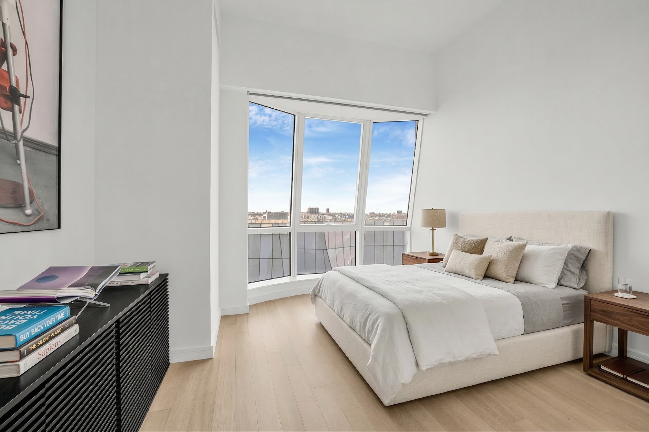 515 West 18th Street, Unit 1504 Manhattan, NY 10011 - Photo 8 of 11 a bedroom with a bed and a window