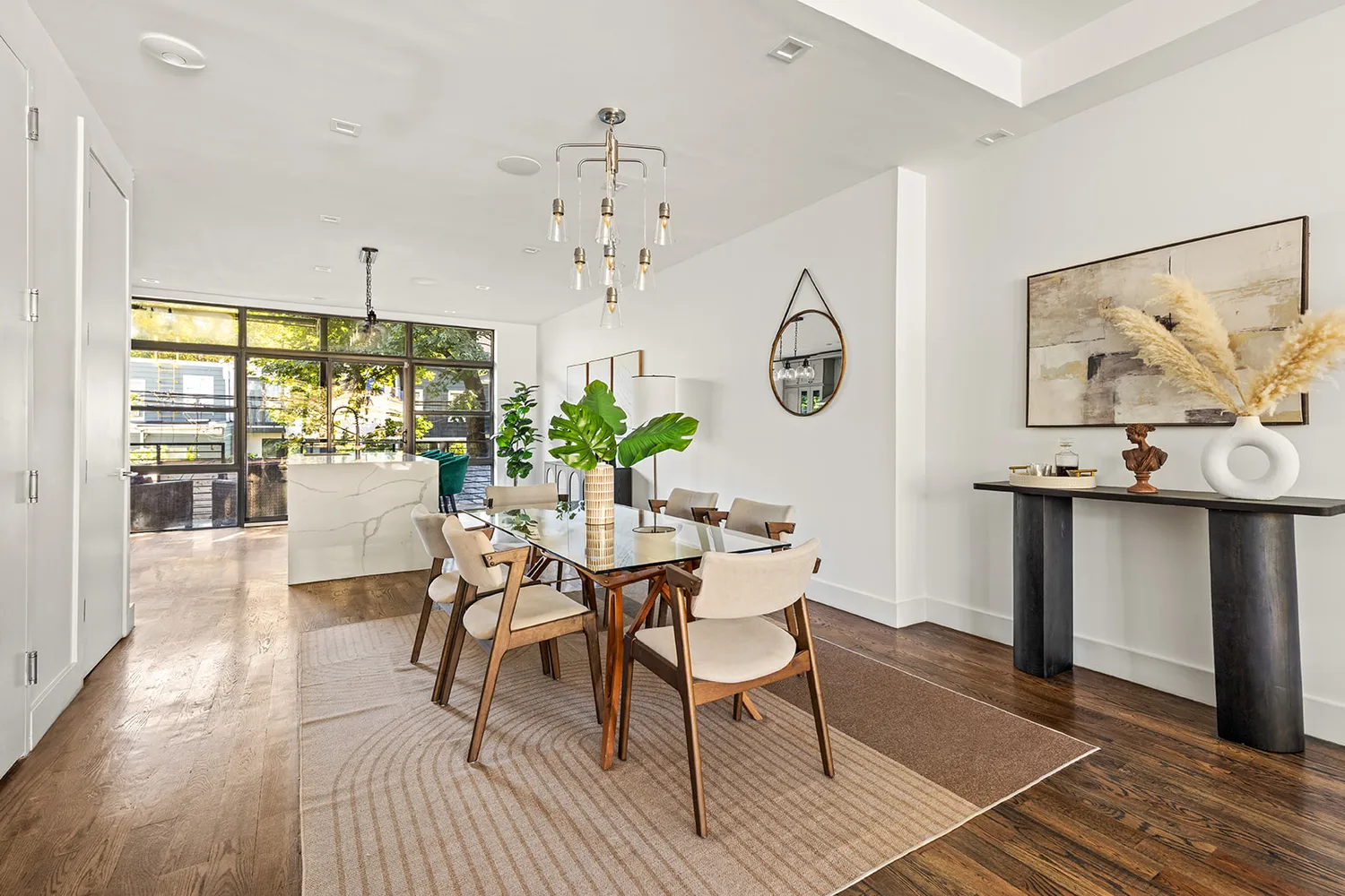 a view of a dining room with furniture window and wooden floor