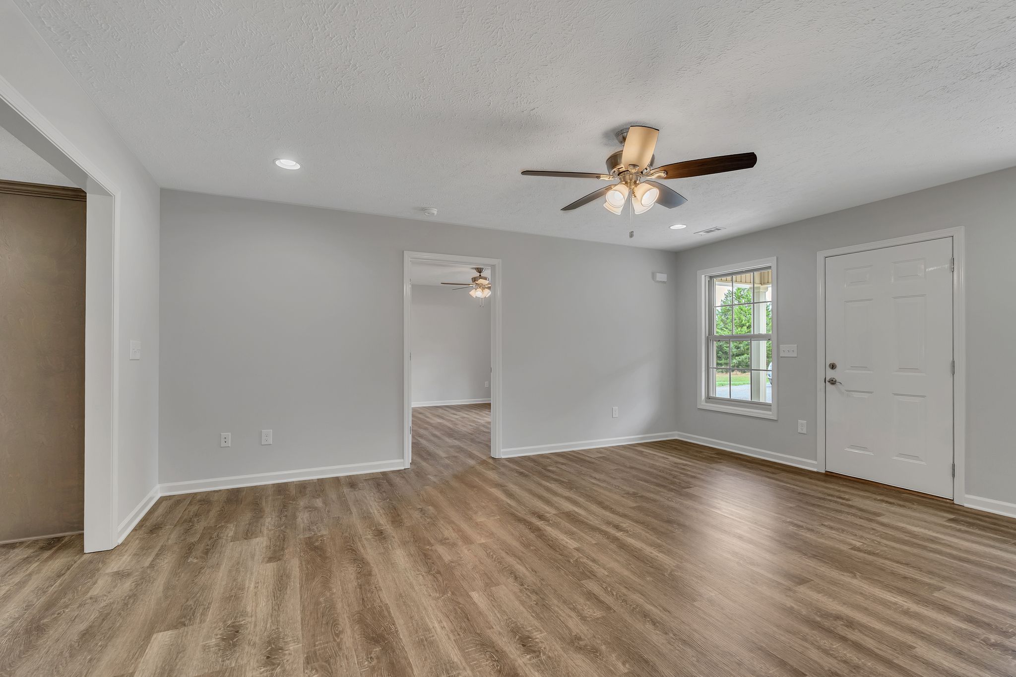 517 Paynes Church Road Estill Springs, TN 37330 - Photo 8 of 32 wooden floor in an empty room with a window