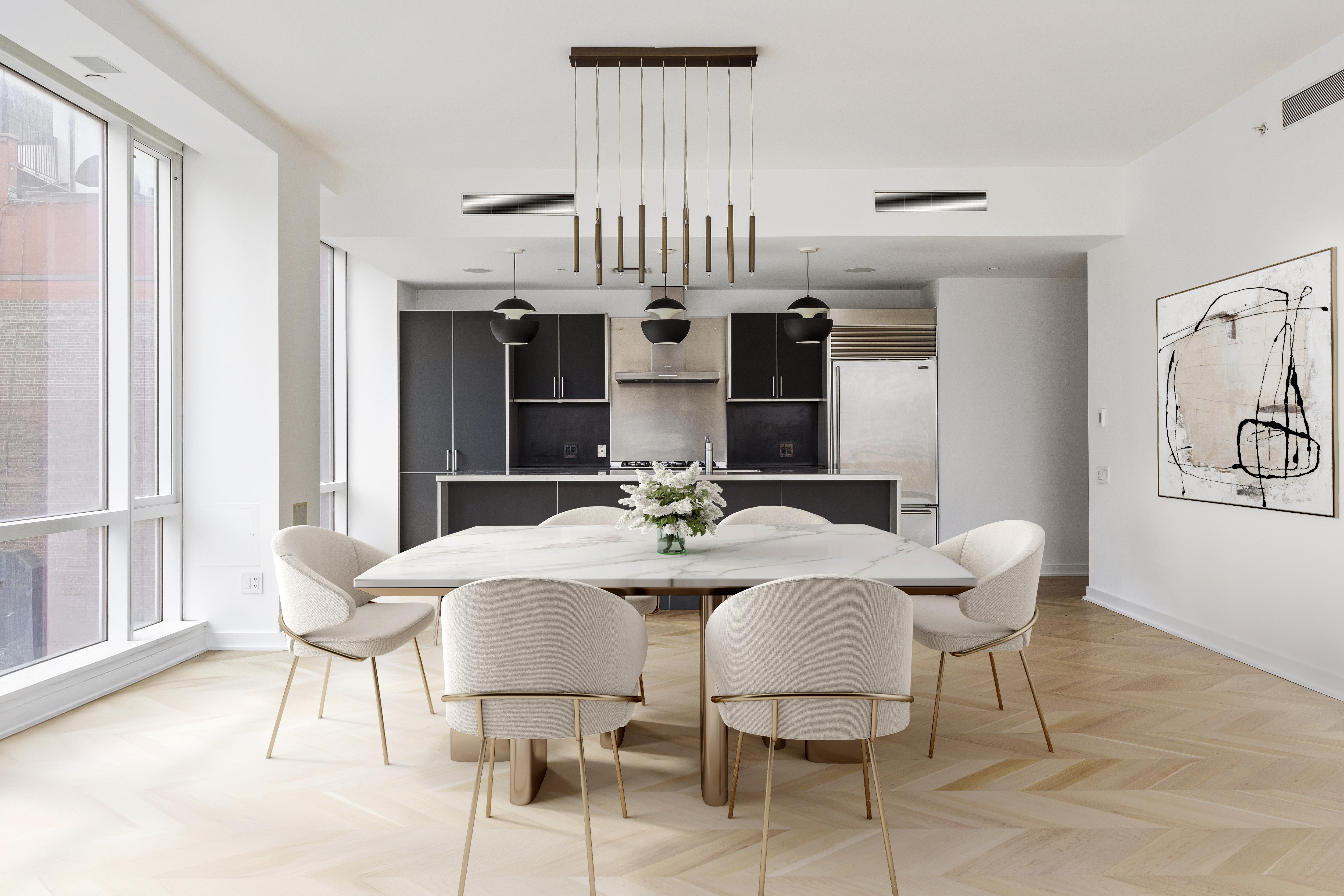 330 Spring Street, Unit 6A Manhattan, NY 10013 - Photo 3 of 11 a view of a dining room with furniture and chandelier