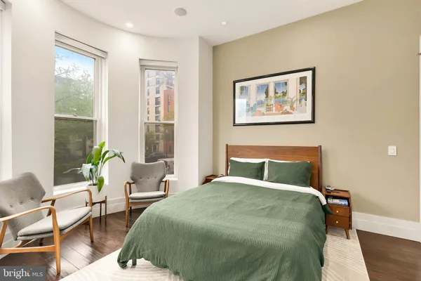 a bedroom with furniture and window