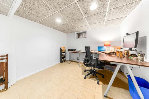 a view of a workspace with furniture