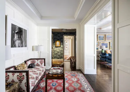 a bedroom with furniture and a wooden floor