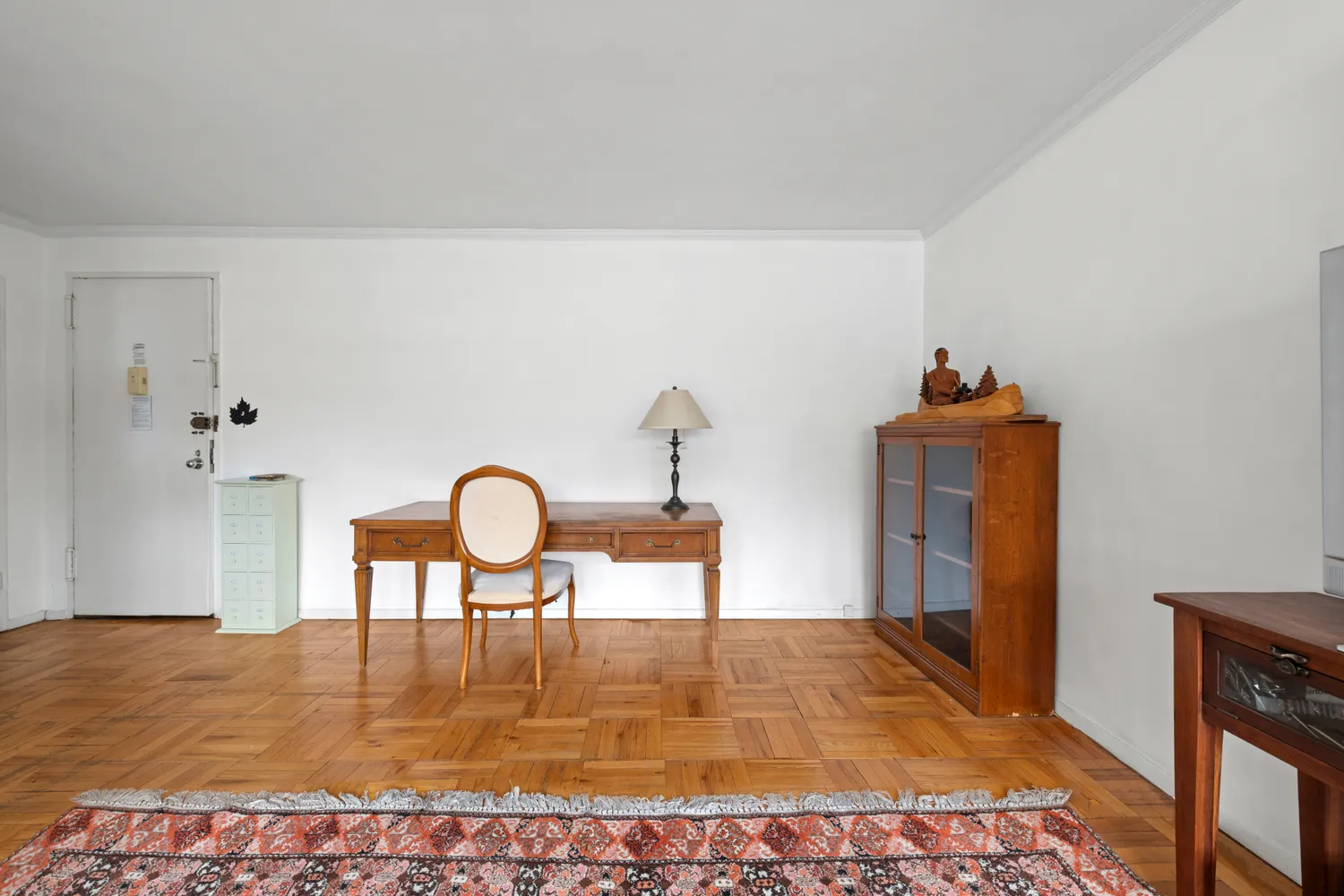 a dining room with table chairs and wooden floor