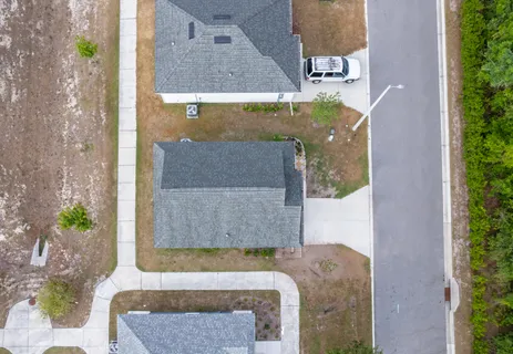 an aerial view of a house with outdoor space