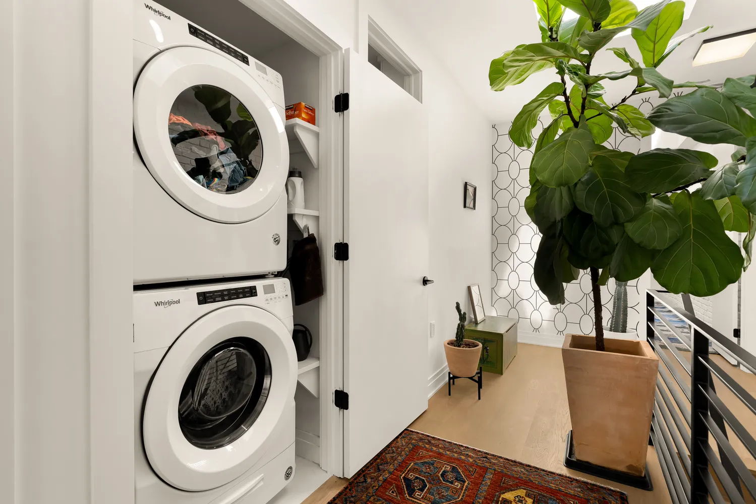 a view of a bedroom with washer and dryer