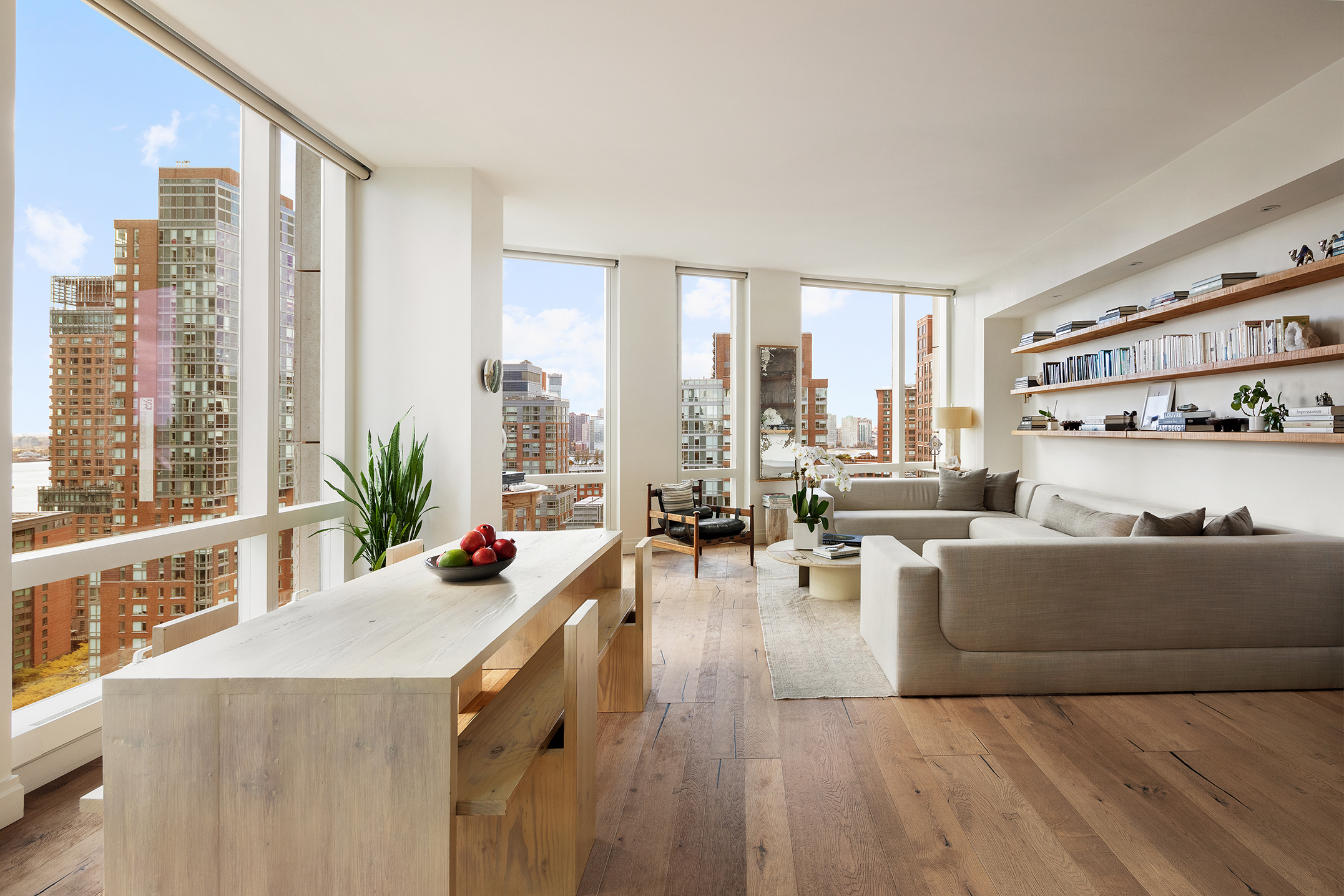 101 Warren Street, Unit 2010 Manhattan, NY 10007 - Photo 2 of 18 a living room with furniture and large windows