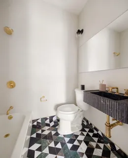 a bathroom with a sink a toilet and a bathtub