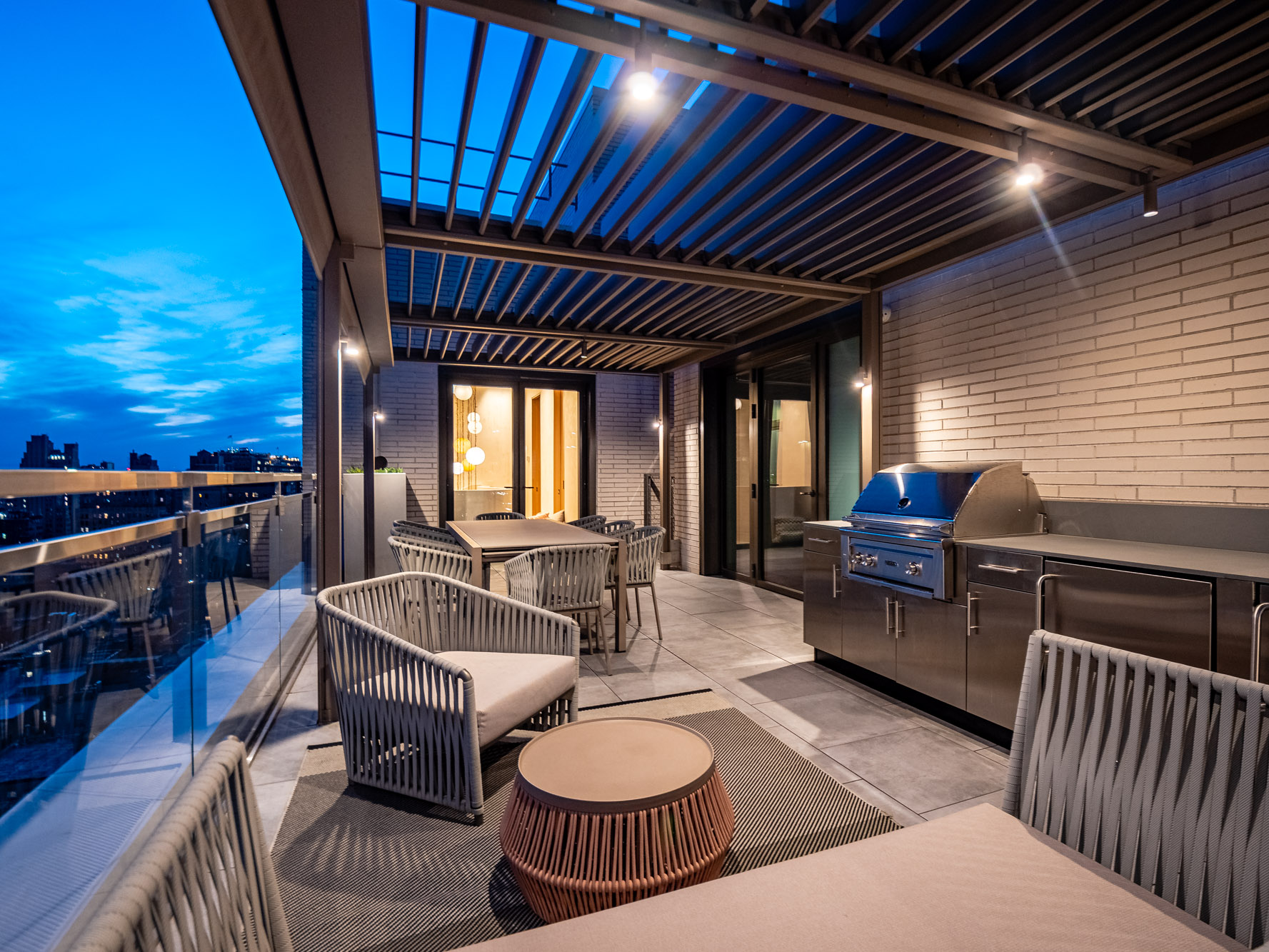 55 West 17th Street, Unit PH Manhattan, NY 10011 - Photo 23 of 36 a living room with furniture and a flat screen tv