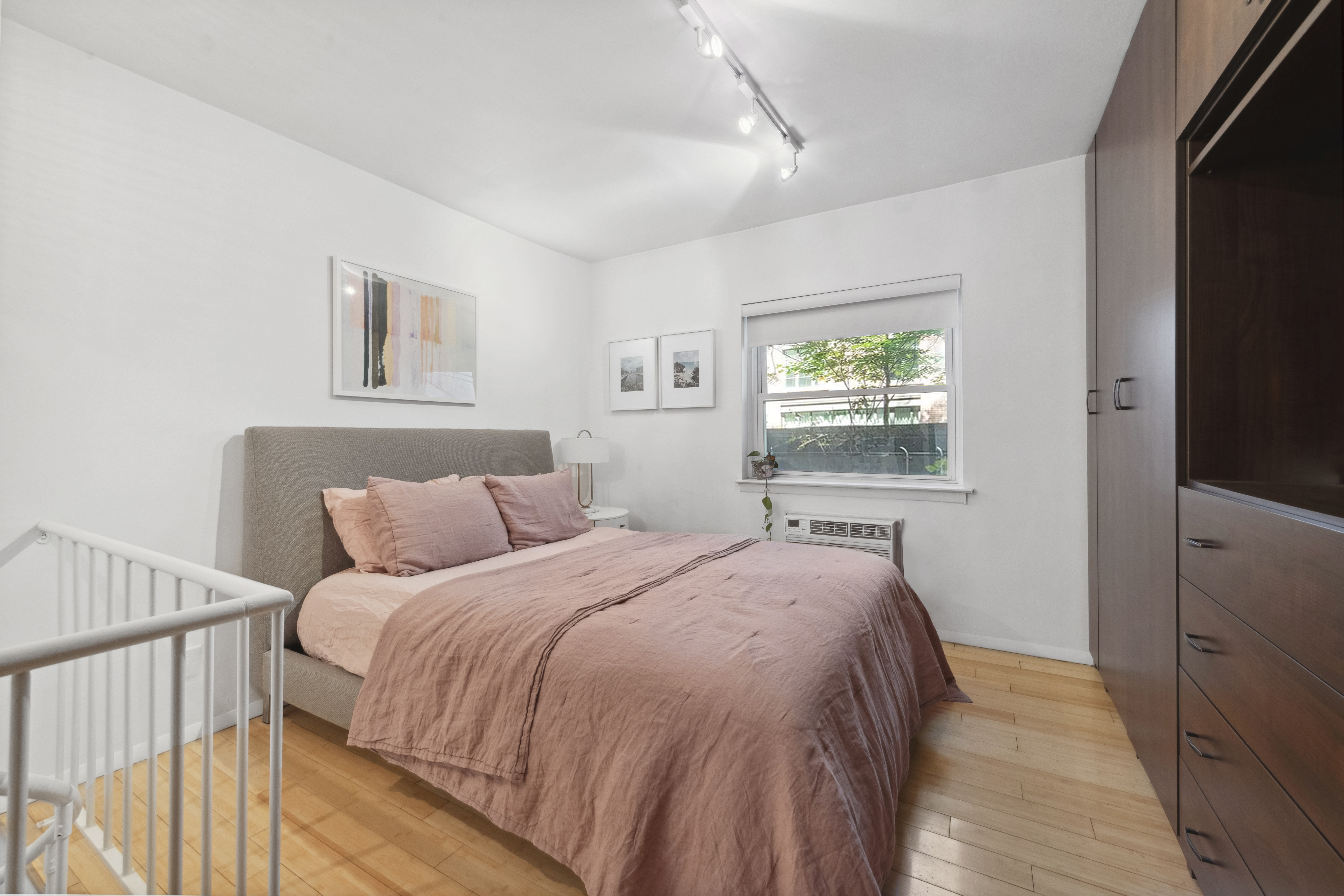 211 Thompson Street, Unit GLD Manhattan, NY 10012 - Photo 6 of 10 a bedroom with a bed and a window