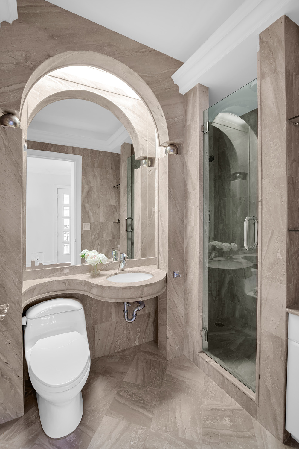 200 Riverside Boulevard, Unit 44A Manhattan, NY 10069 - Photo 15 of 22 a living room with a toilet and a mirror