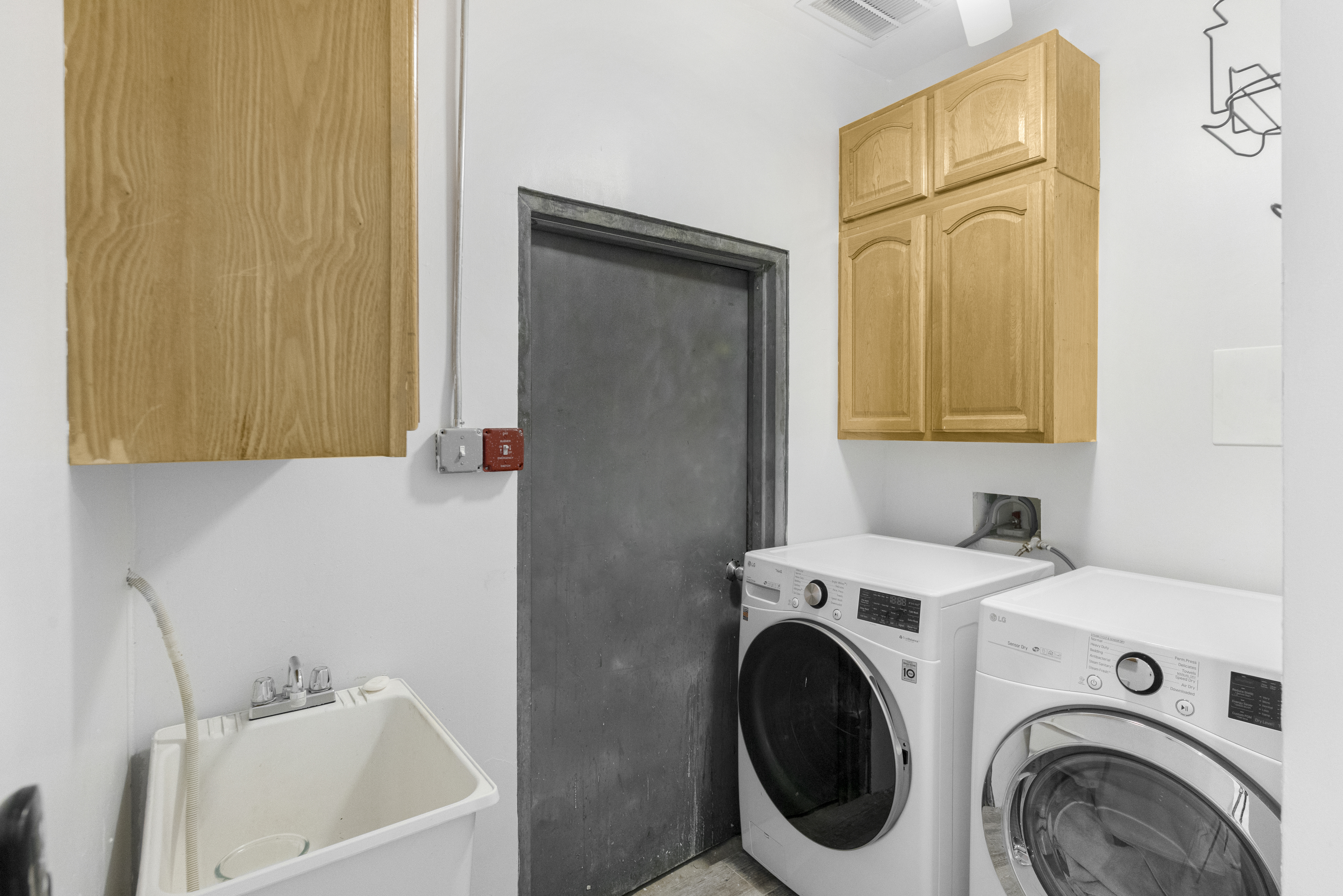 1061 Fulton Street, Unit 1 Brooklyn, NY 11238 - Photo 9 of 13 a bathroom with a sink a washer and dryer