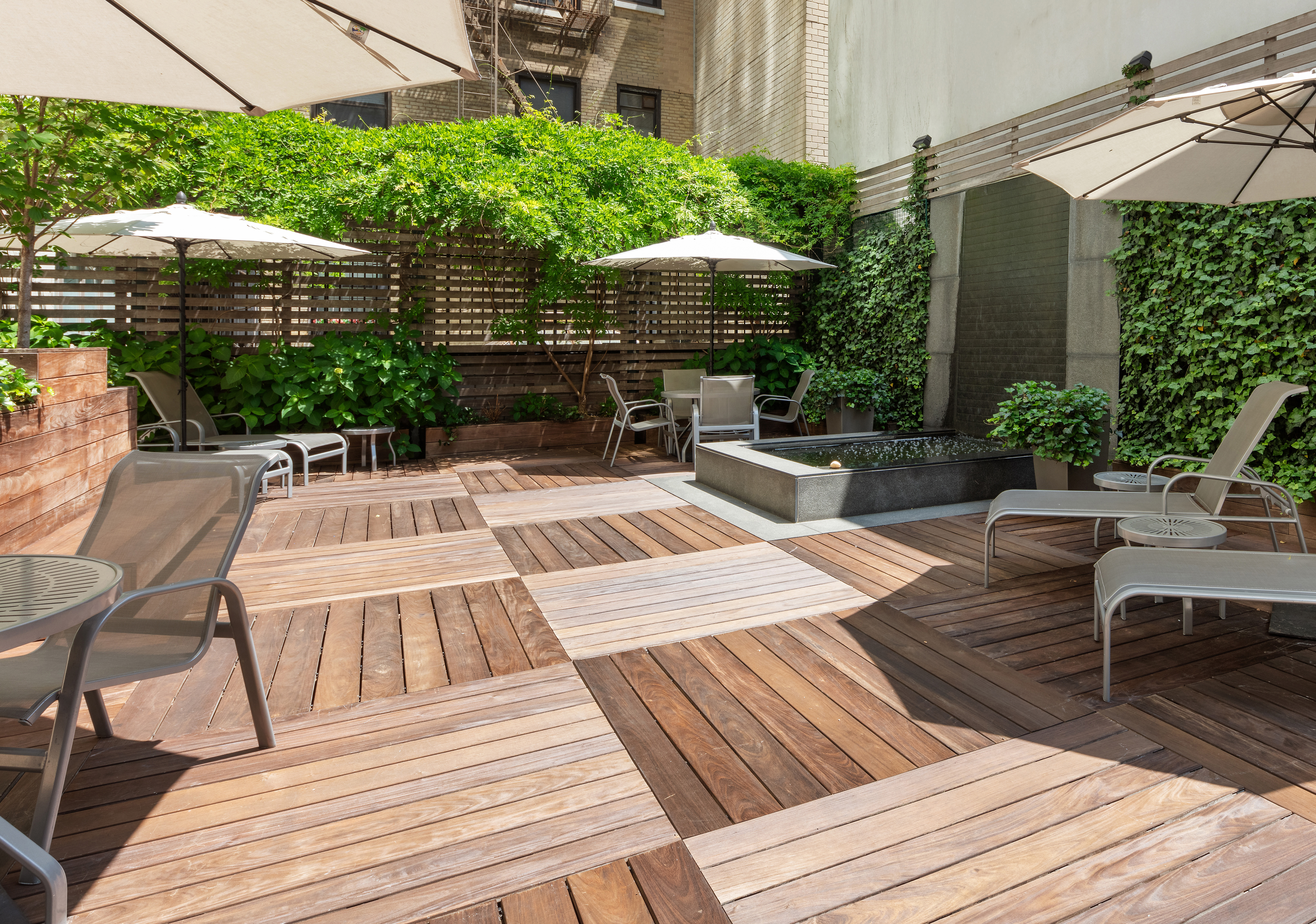 799 Park Avenue, Unit 17A Manhattan, NY 10021 - Photo 10 of 12 a view of a wooden deck with furniture