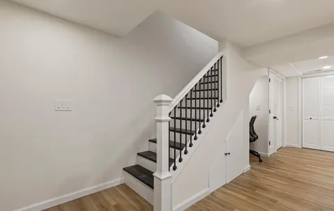 a view of entryway with wooden floor