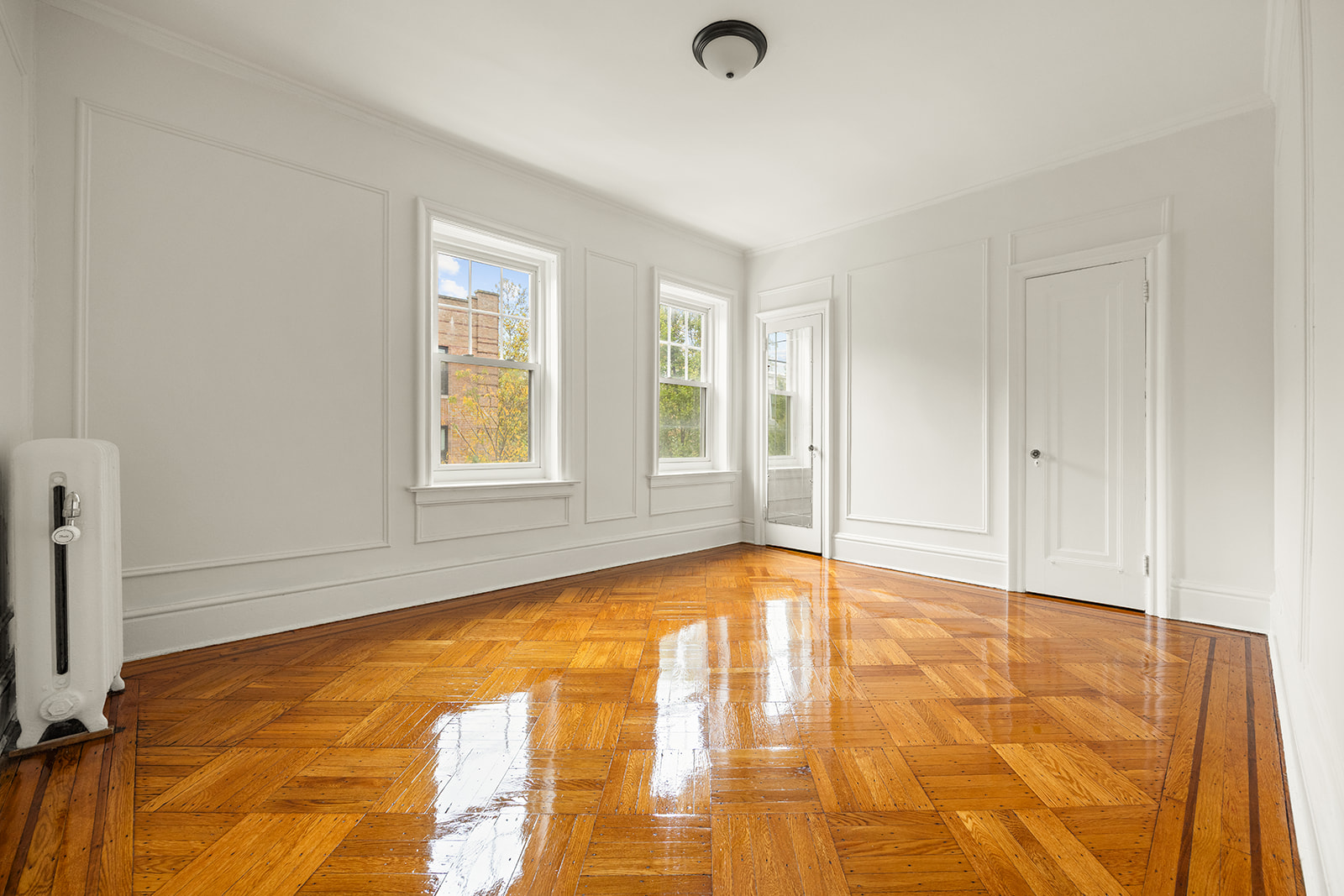 1523 11th Avenue, Unit 2 Brooklyn, NY 11215 - Photo 6 of 11 a view of an empty room with window and a kitchen