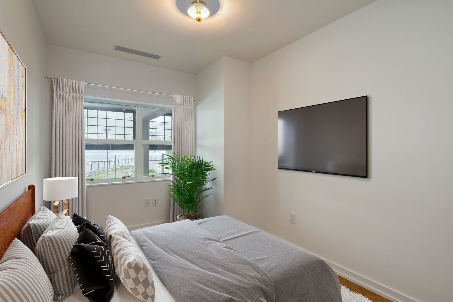 184 Kent Avenue, Unit C107 Brooklyn, NY 11249 - Photo 6 of 18 a bedroom with a bed and a window