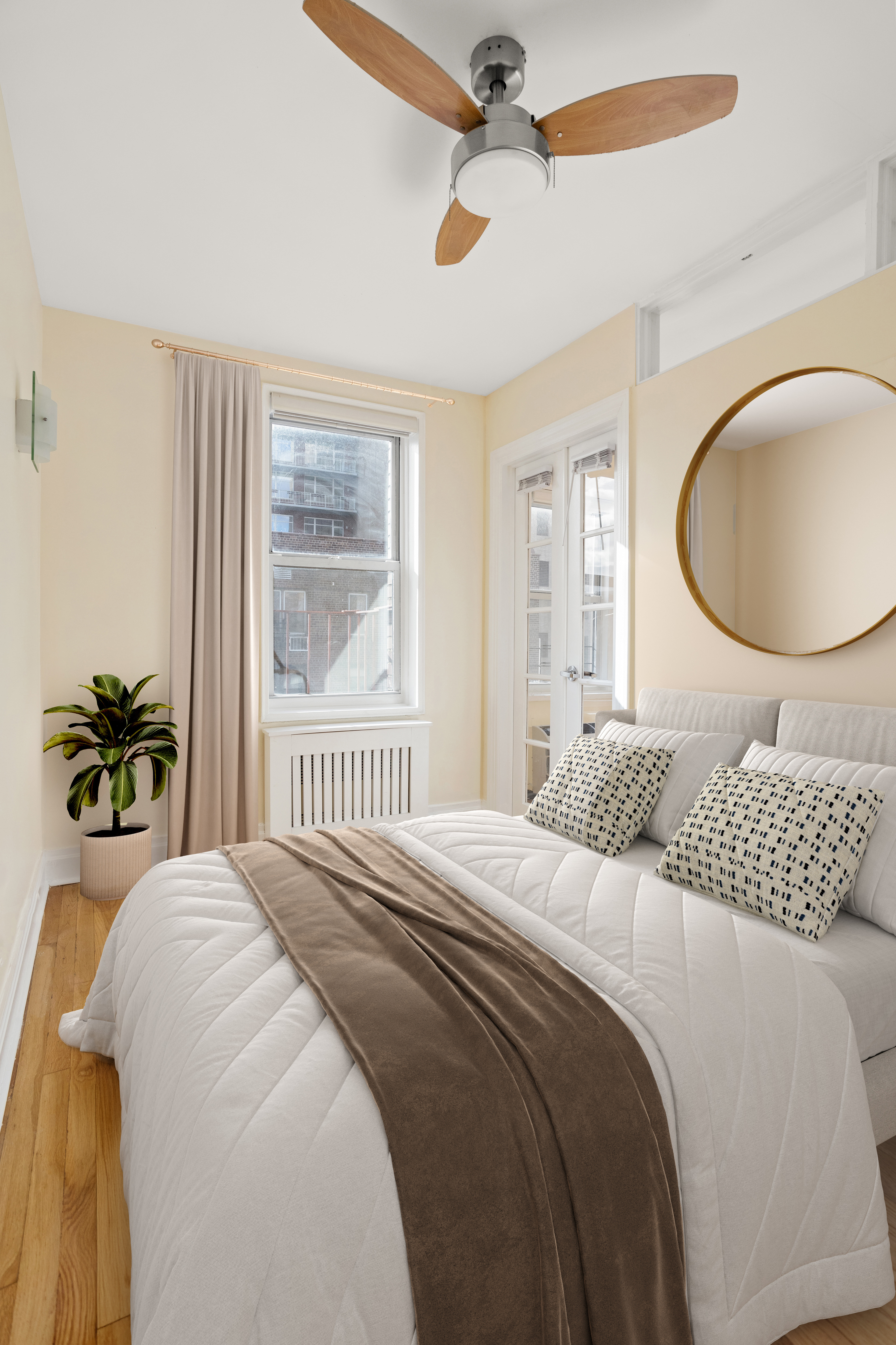 140 7th Avenue, Unit 7M Manhattan, NY 10011 - Photo 8 of 11 a bedroom with a bed and a chandelier