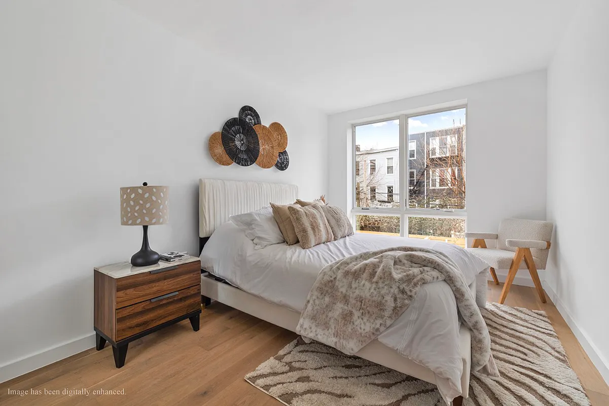 1220 Putnam Avenue, Unit 2B Brooklyn, NY 11221 - Photo 3 of 5 a bedroom with a bed and a window