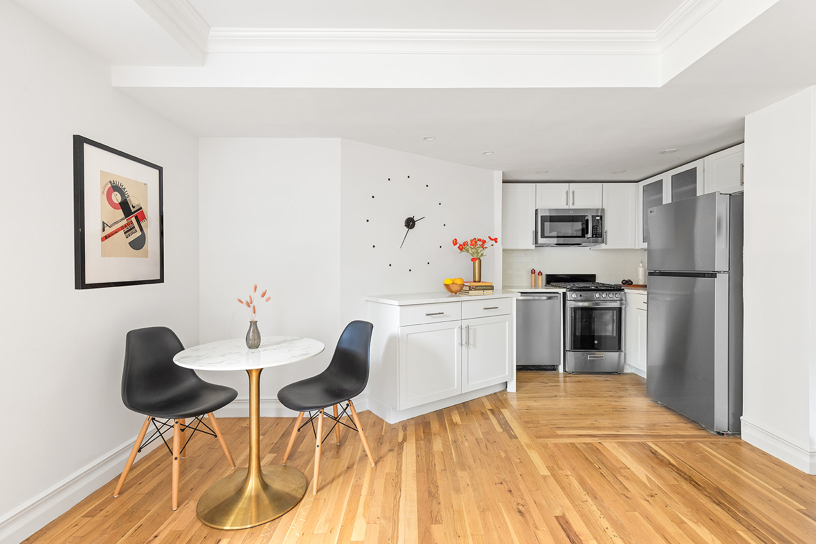 1139 Prospect Avenue, Unit 1L Brooklyn, NY 11218 - Photo 2 of 8 a kitchen with granite countertop cabinets a refrigerator and a stove top oven