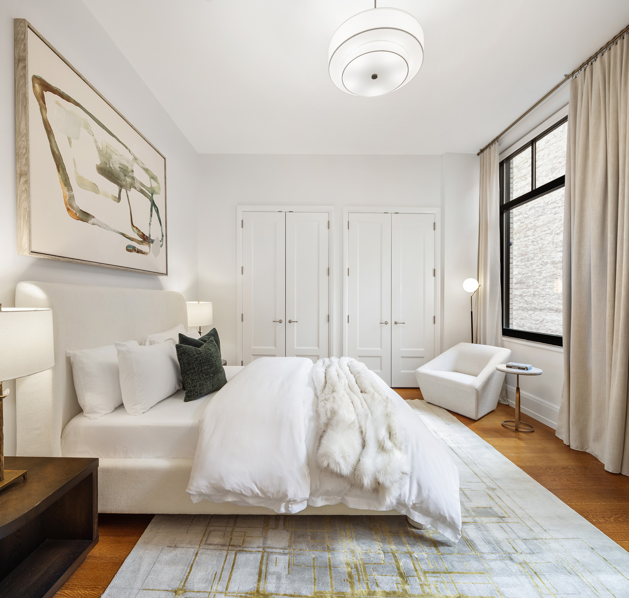 10 Madison Square West, Unit 7A Manhattan, NY 10010 - Photo 6 of 8 a bedroom with a bed and window