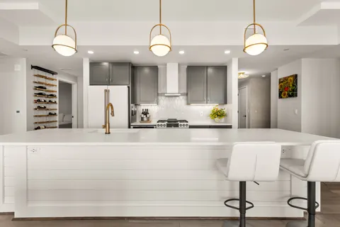 a bathroom with a sink a bathtub and a mirror