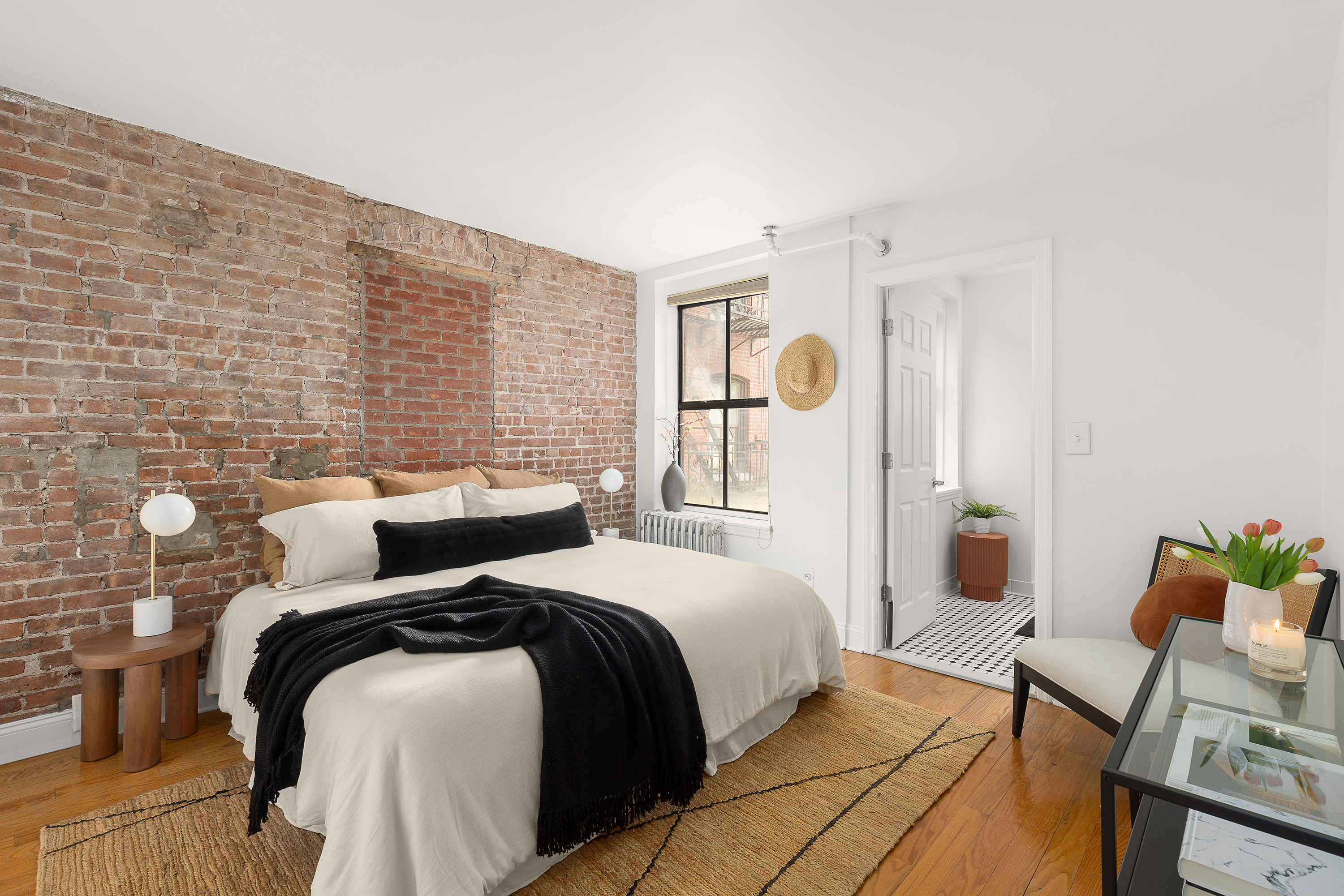 138 Baltic Street, Unit 4C Brooklyn, NY 11201 - Photo 8 of 12 a bedroom with a bed and a lamp