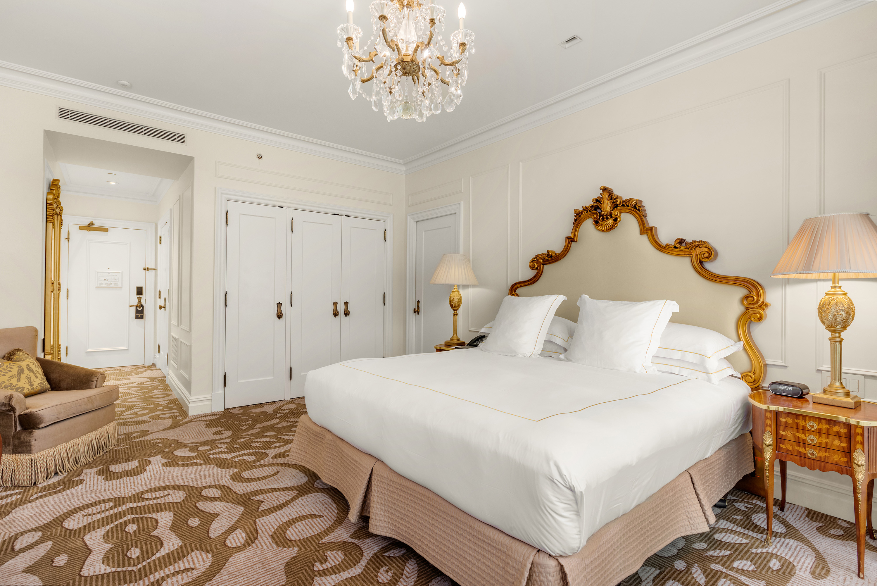 1 Central Park South, Unit 1336 Manhattan, NY 10019 - Photo 3 of 21 a bedroom with a bed and a chandelier