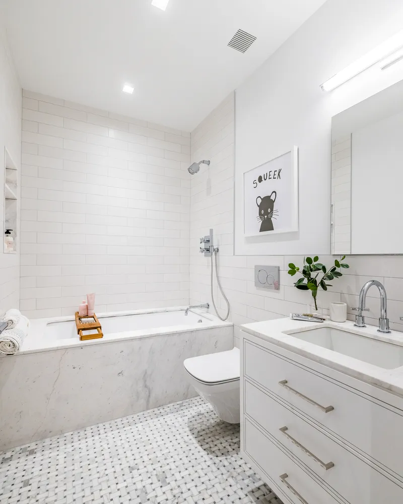 a bathroom with a sink a toilet and a bathtub