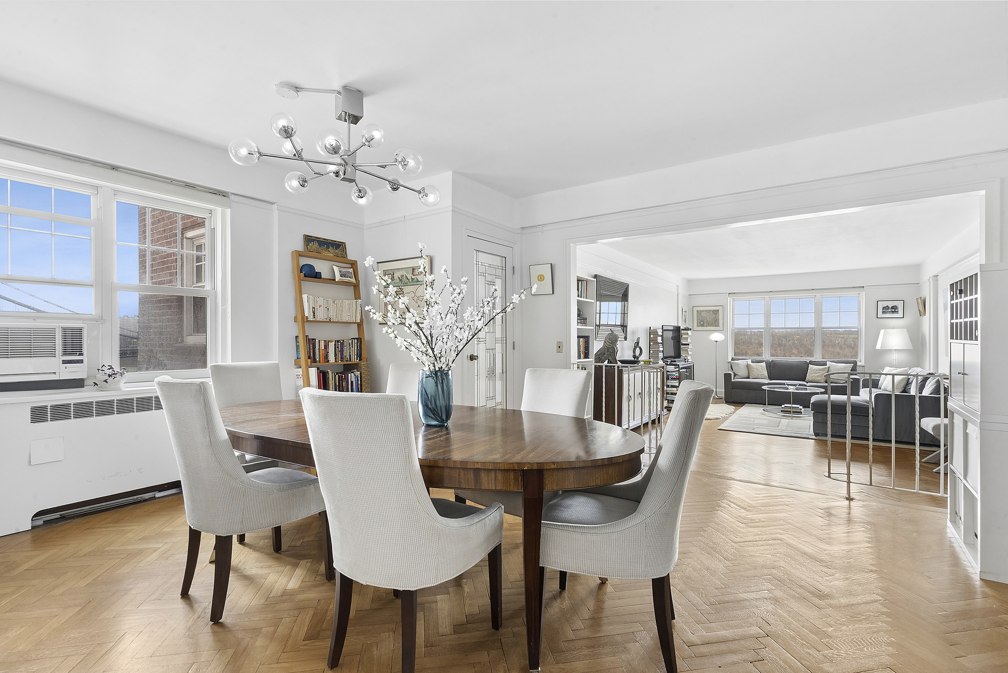 160 Cabrini Boulevard, Unit 89 Manhattan, NY 10033 - Photo 3 of 17 a view of a dining room with furniture and wooden floor
