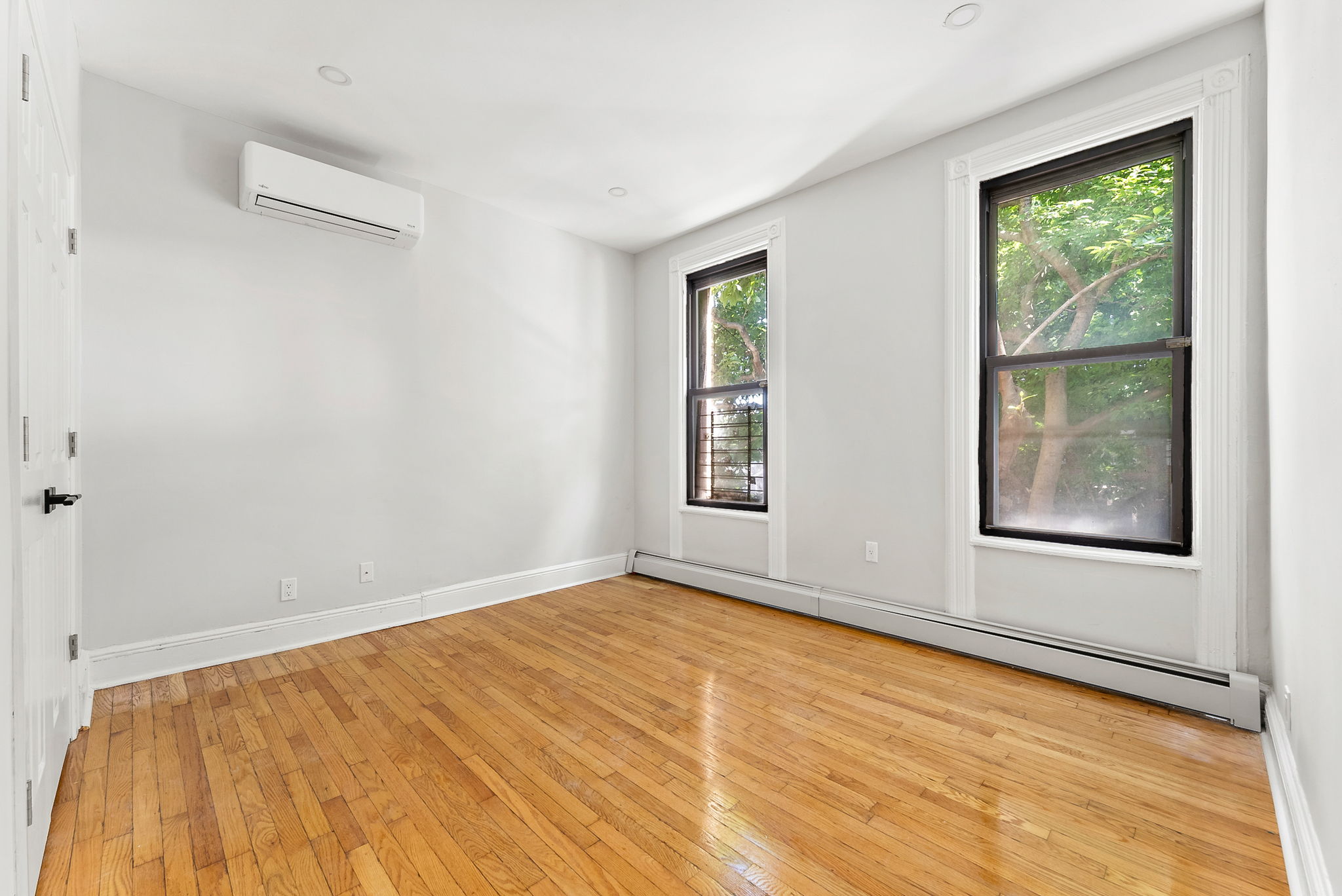 1414 30th Road Queens, NY 11102 - Photo 7 of 16 a view of an empty room with a window