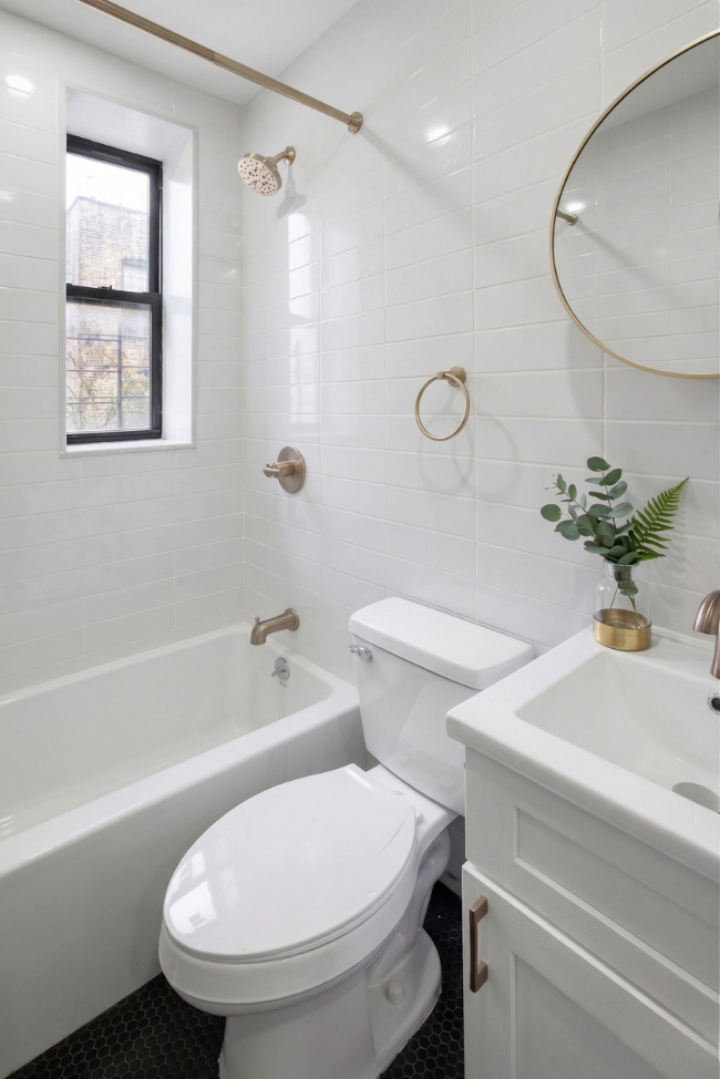 41 Clarkson Avenue, Unit 1H Brooklyn, NY 11226 - Photo 4 of 12 a bathroom with a sink a toilet and a bathtub