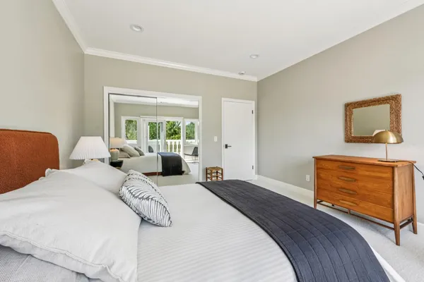 a bedroom with furniture and a window