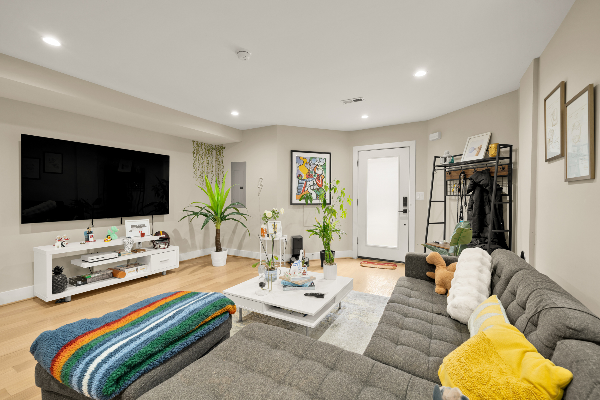 14 T Street Northeast, Unit 1 Washington, DC 20002 - Photo 8 of 39 a living room with furniture and a flat screen tv