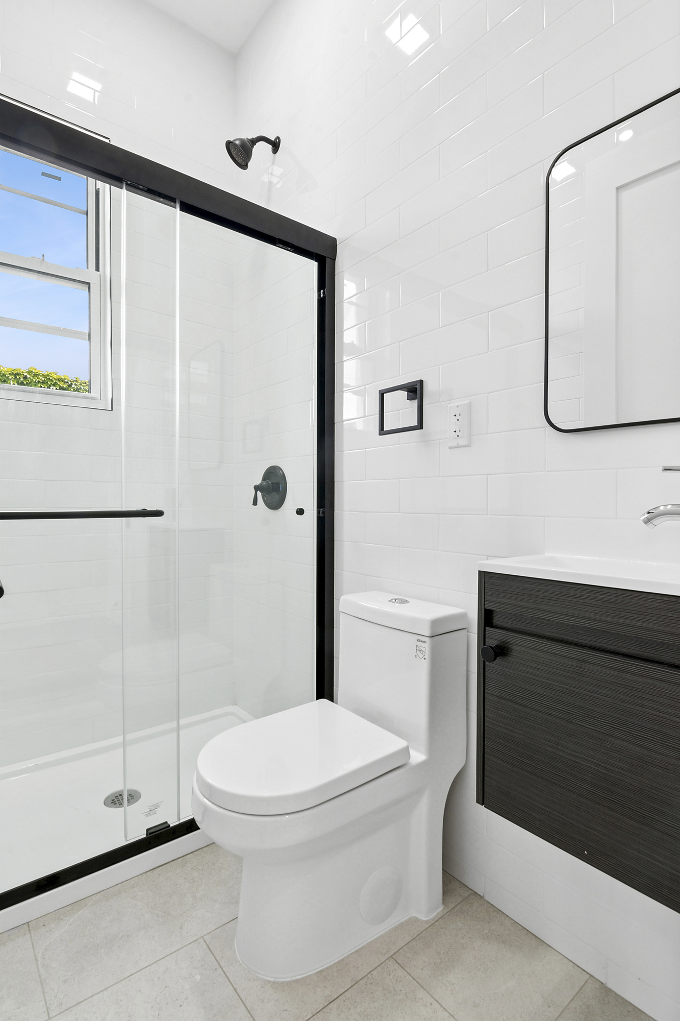 41-05 20th Avenue Queens, NY 11105 - Photo 9 of 20 a bathroom with a toilet a sink and shower