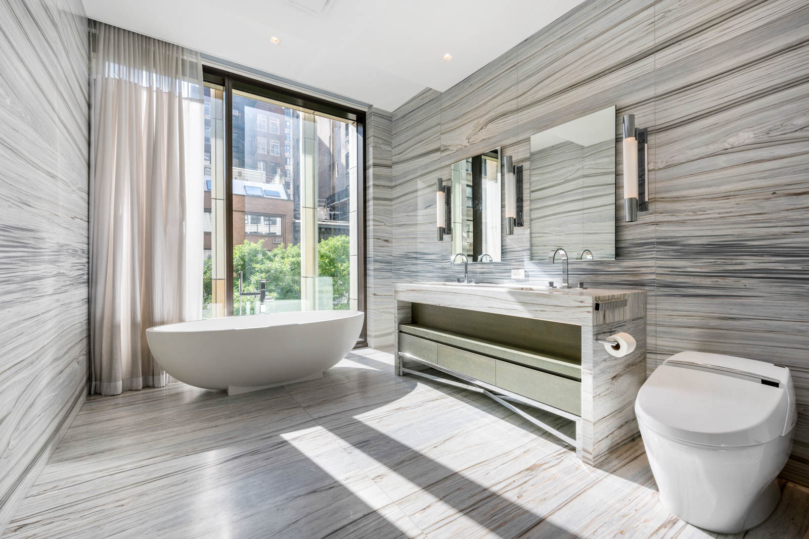 23 East 22nd Street, Unit TH2 Manhattan, NY 10010 - Photo 8 of 26 a bathroom with a sink a toilet a mirror and window