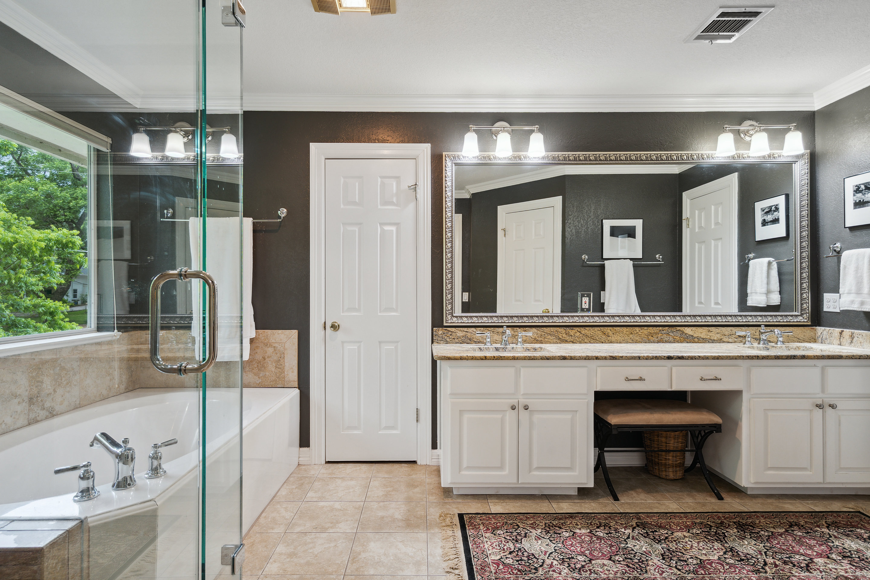 2603 Pearce Road Austin, TX 78730 - Photo 17 of 41 a bathroom with a tub sink and mirror